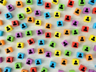 Wooden blocks of different colours with images of people